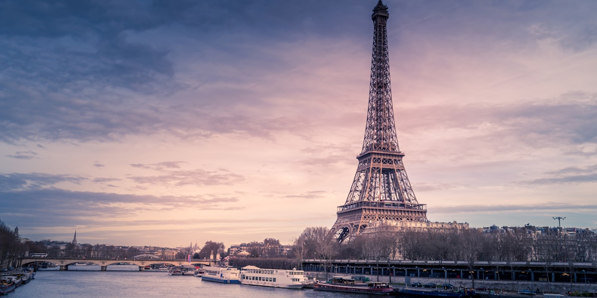 Paris cityscape with the Eiffel Tower — Stade de France hosts BTS, Accor Arena hosts TWICE