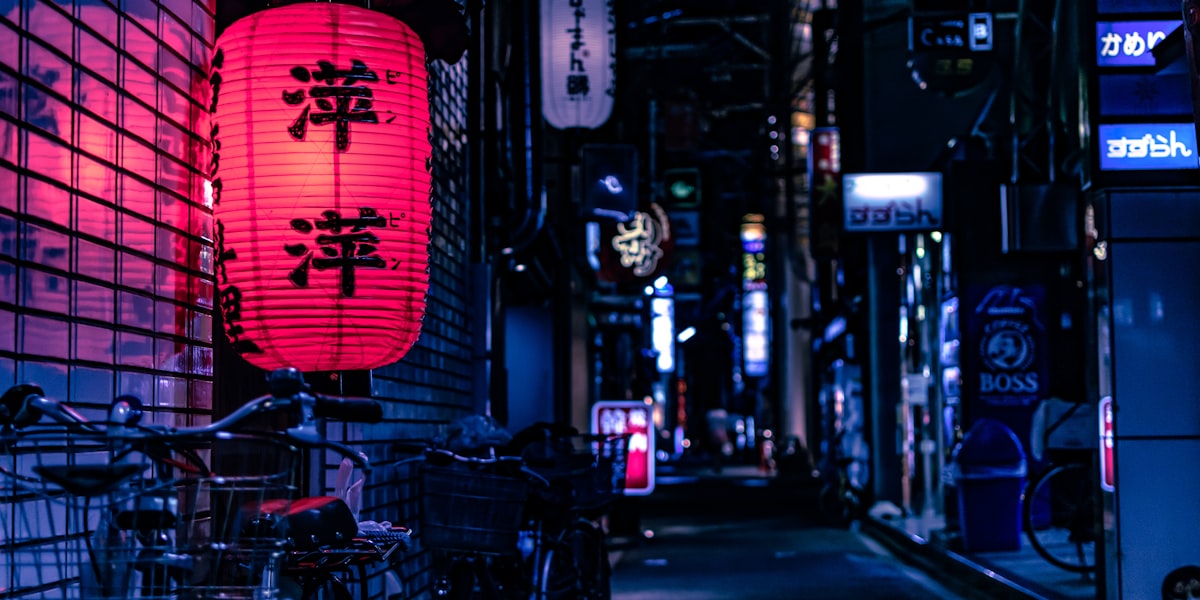 Japanese convenience store at night — pick up your tickets at Lawson or 7-Eleven