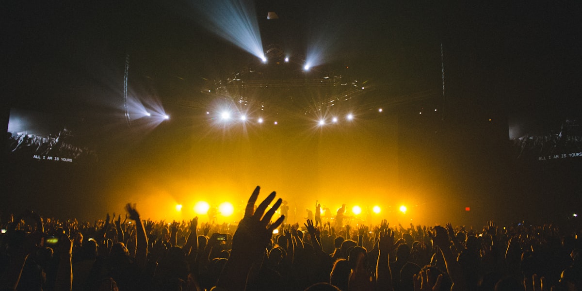Concert arena packed with fans and lights
